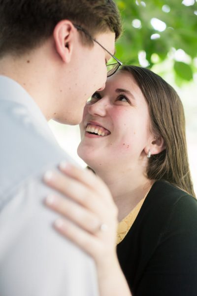 Girl smiles at groom for candid photo by Atlanta, GA Engagement Photographer Mike glatzer
