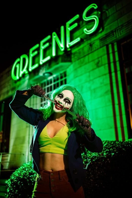 female joker cosplay with knives