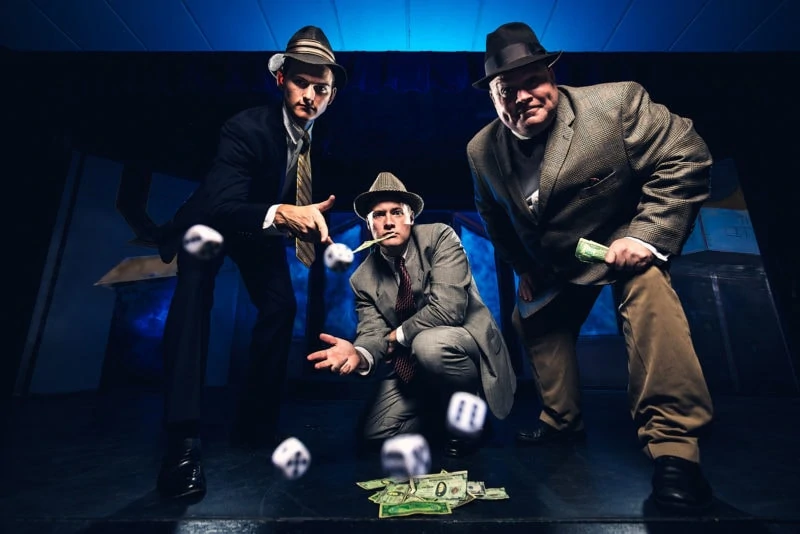 creative flash portrait of mobsters gambling with dice