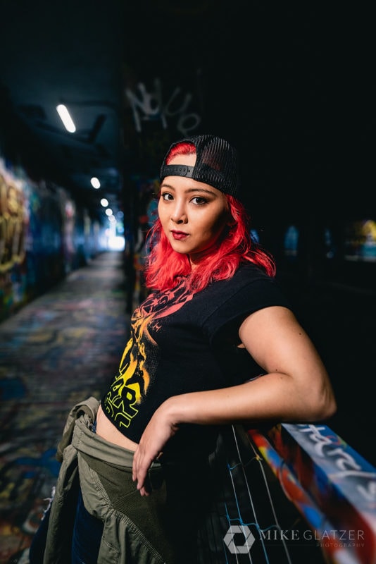 punk girl leans on rail krog street tunnel