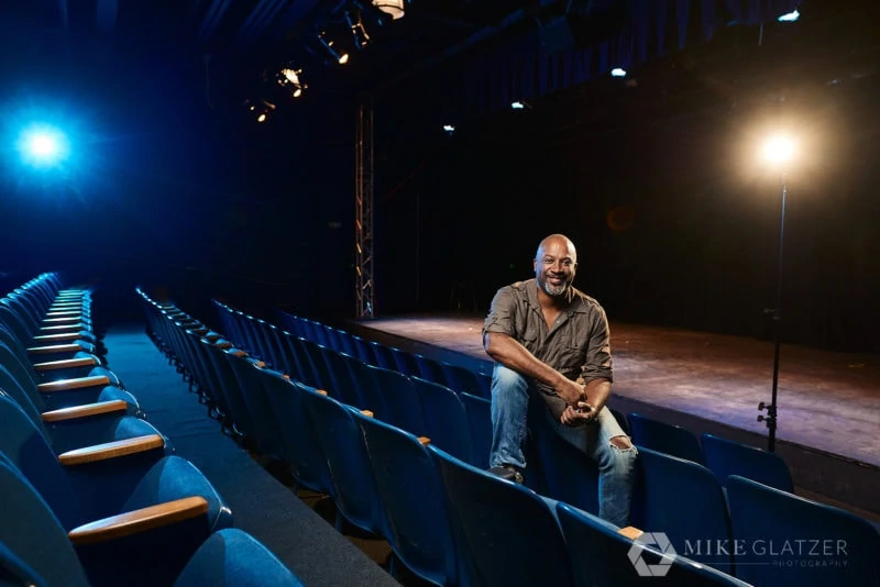 black director seated in theater