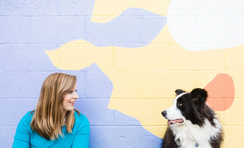 dog trainer wears bright colors for brand shoot