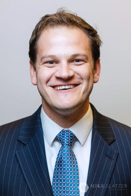 lawyer headshot with dark blue suit colors