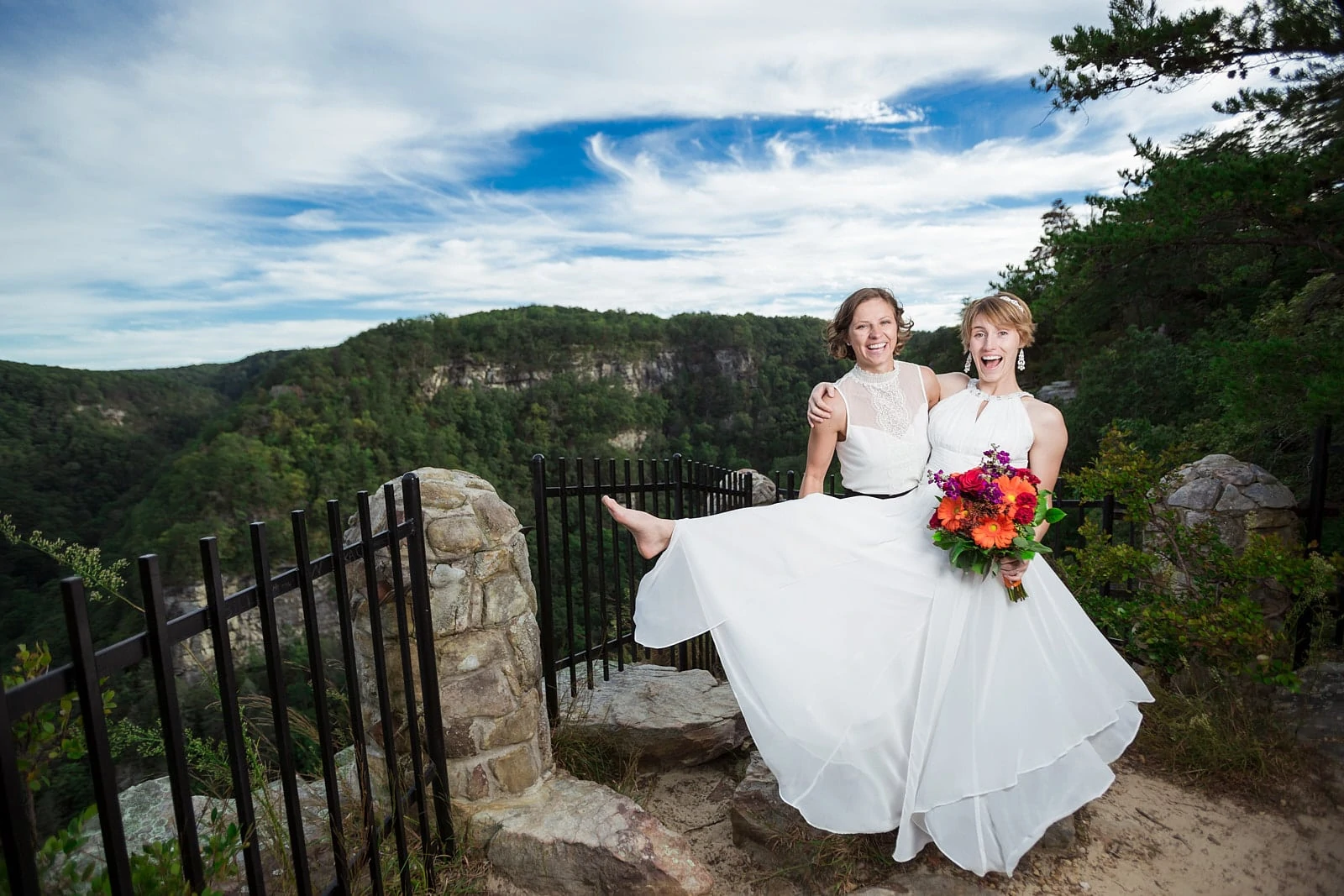 lesbian wedding couple smiling at Cloudland Canyon