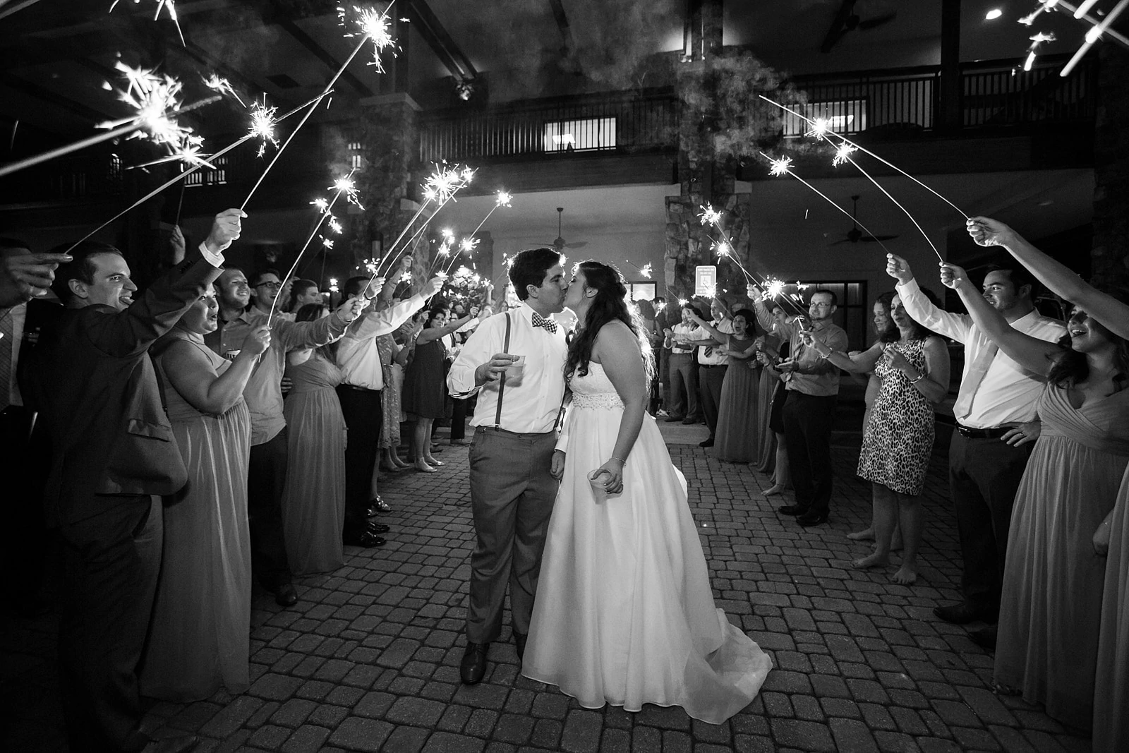 bride and groom kiss during wedding sparkler exit Atlanta