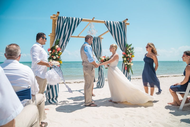 bride and groom exchange vows florida beach ceremony